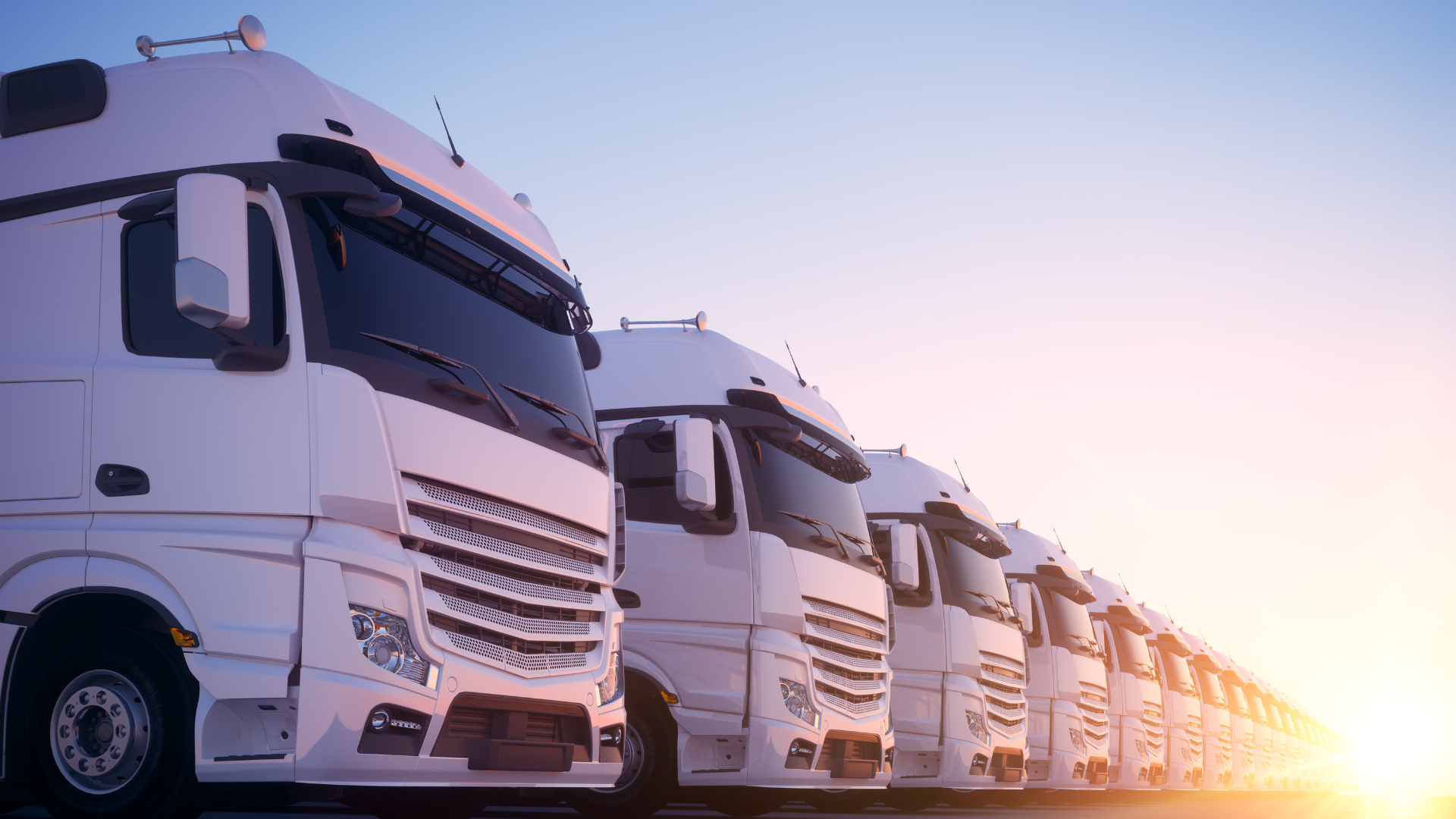 Fleet of trucks/buses at dawn - The Best Industries for RNG Adoption